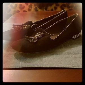 Black loafers with tassels